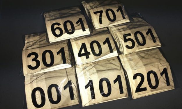 Consecutively Numbered Stickers Completed and stacked in order glowing at night